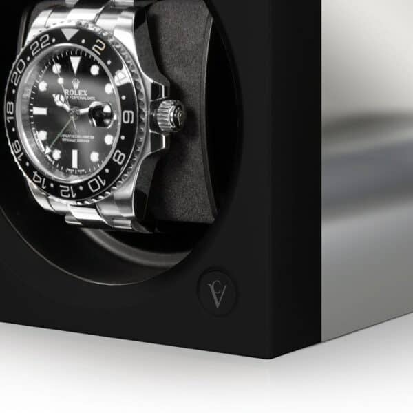 Chronovision One watch winder in a silk black finish with chrome highlights winding a Rolex GMT watch